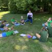 What a lovely way to read - outside and in the shade!