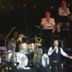 Kathy and the rest of the orchestra applaud Alfie Boe